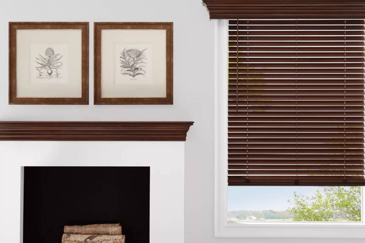 Hunter Douglas Parkland® Wood Shades on a Window Next to a Fireplace and Mantle.