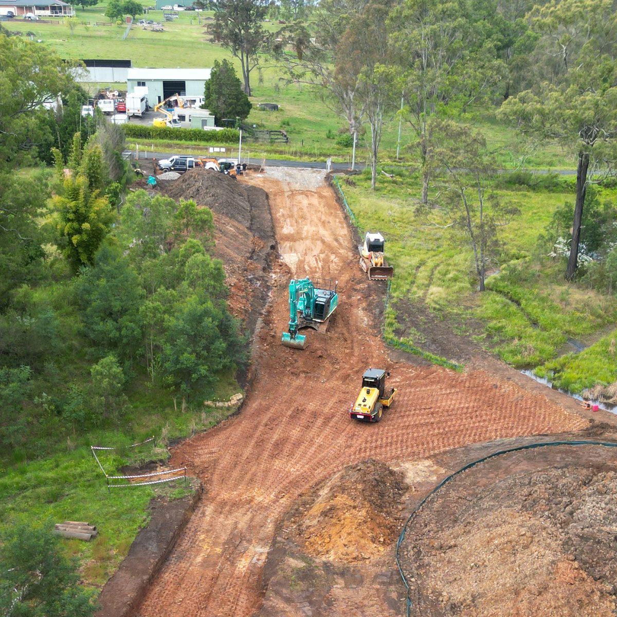 An aerial view of a dirt road being built