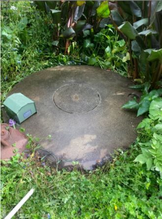 Concrete Tank Nestled in The Lush Grass — Wastewater Treatment System in Nowra, NSW