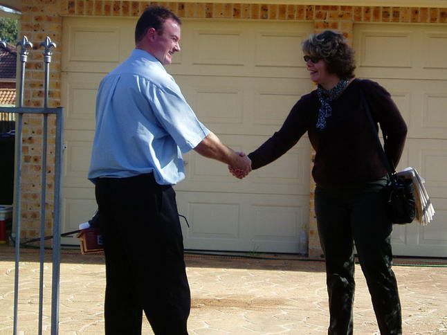 Professional Collaboration Represented Through a Handshake Between a Man And a Woman — Wastewater Treatment System in Nowra, NSW