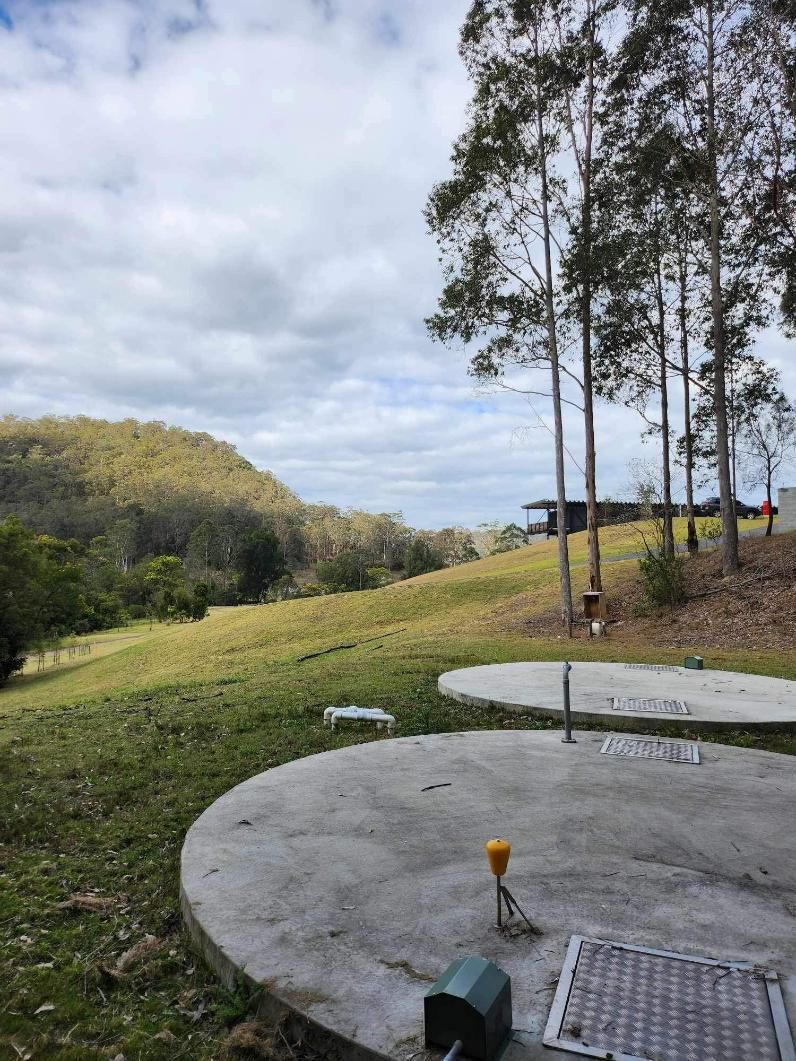Concrete Wastewater System On A Grassy Field — Wastewater Treatment System in Nowra, NSW