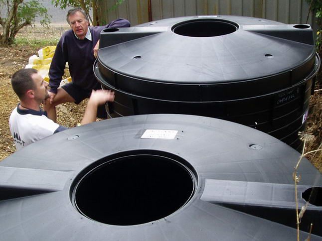 Two Men Having A Conversation Beside The Tanks — Wastewater Treatment System in Nowra, NSW
