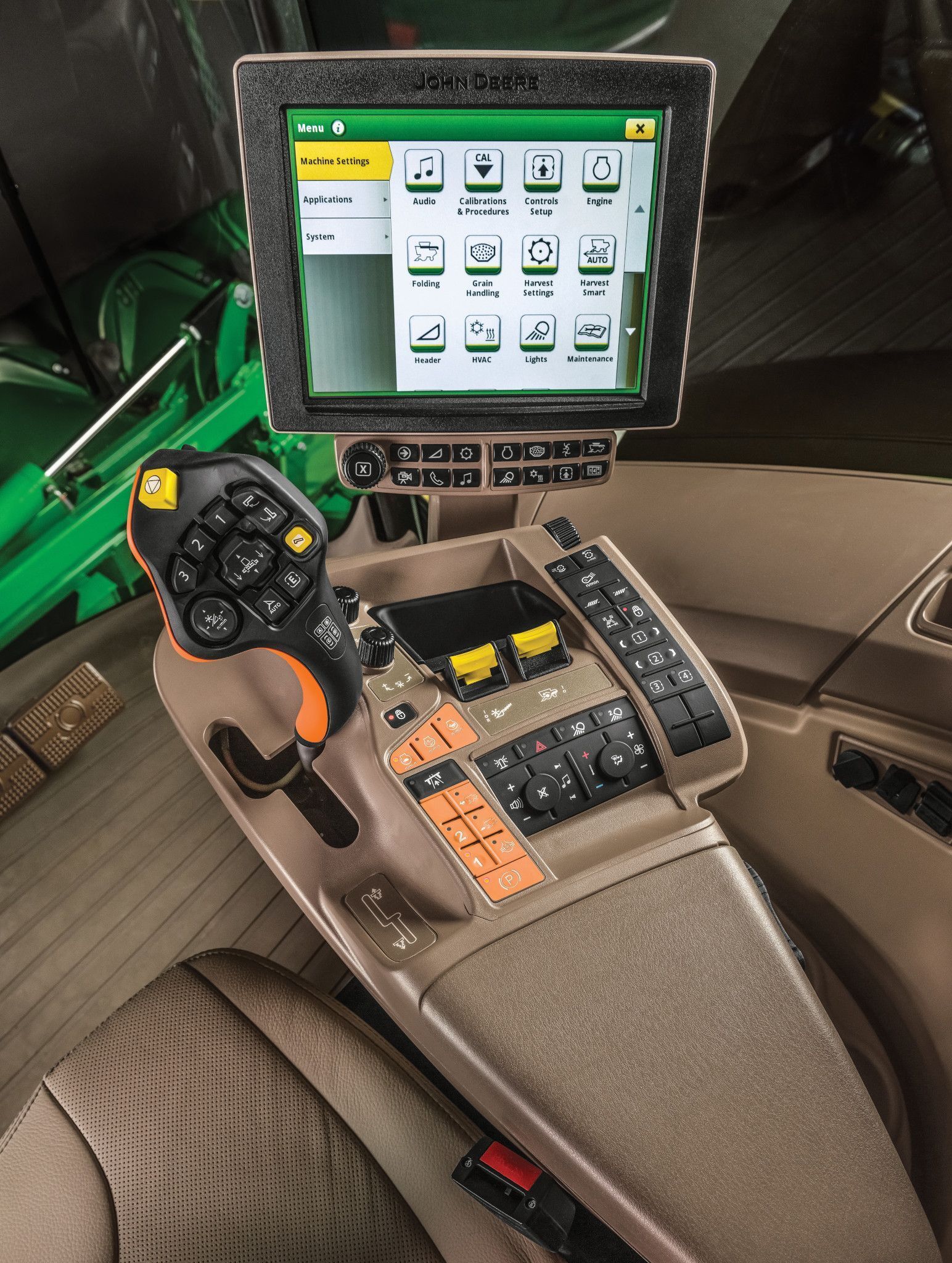 View of control screens in John Deere Combine cab