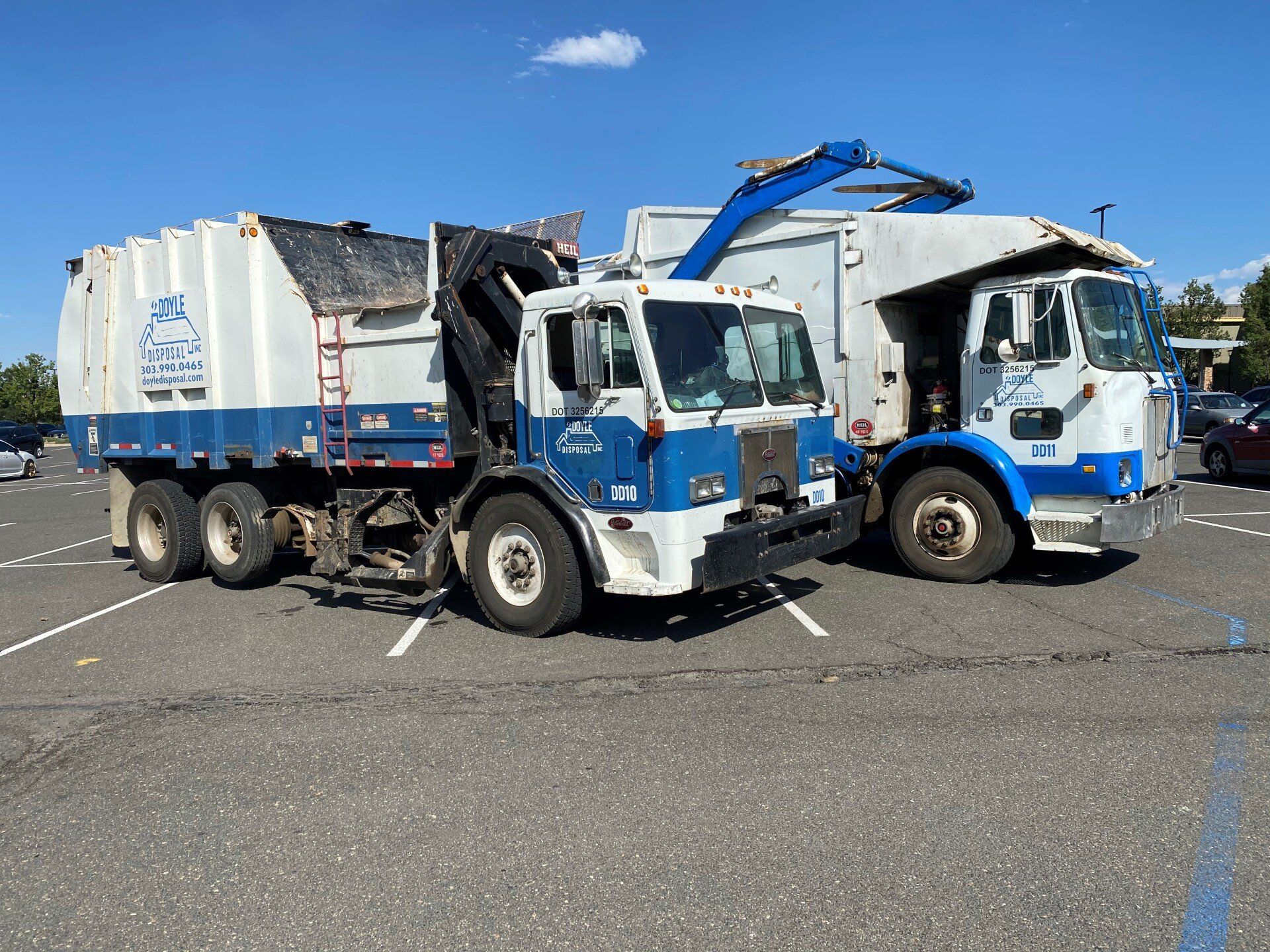 Garbage Truck Picking Up the Trash — Dumont, CO — Doyle Disposal