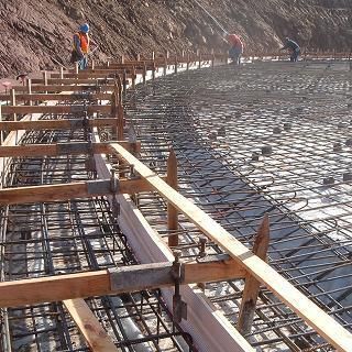 A group of construction workers are working on a construction site.