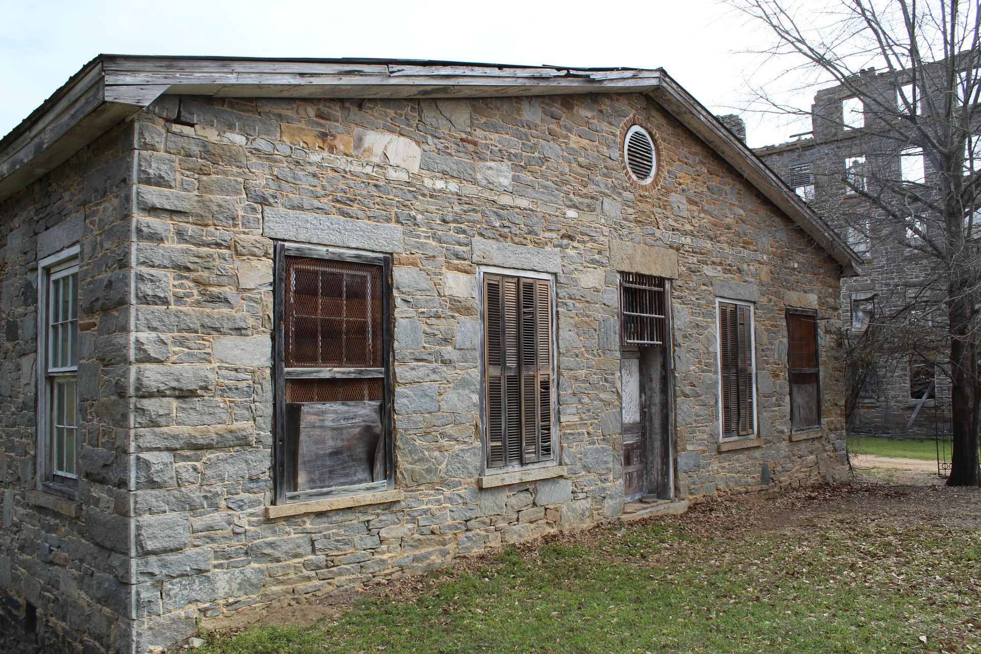 The stone facade of the 1800s Tallassee Warehouse