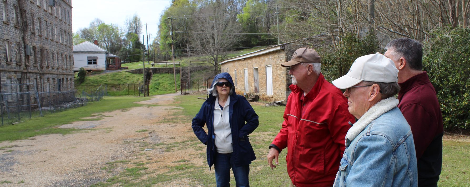 Talisi Historical Preservation Society officers guide Dr. Tommy Brown through the historic Tallassee Confederate Armory Grounds(from left to right: Susan Dragone - Historian, Alan Parker - President, Bob Reed - Secretary, Dr. Tommy Brown)