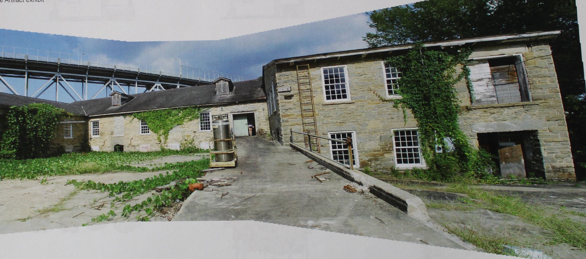 The Tallassee Armory in 2009 covered in vegetation
