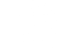 A blue and white logo for the Tallassee Redevelopment Authority
