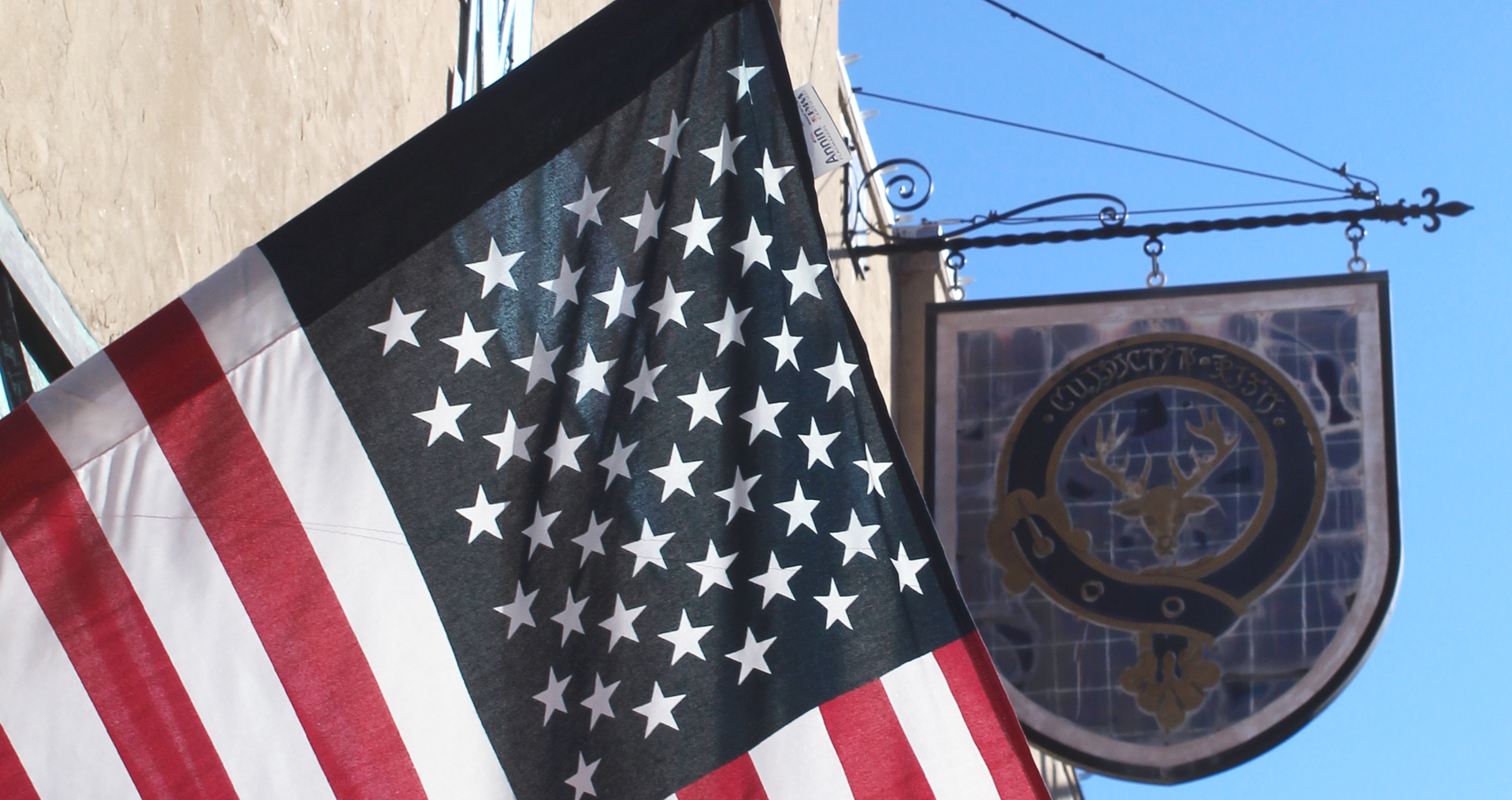 The American Flag flows proudly in Tallassee Downtown in front of Mill Collective