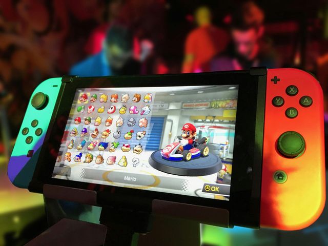 A person is playing a video game on a nintendo switch.