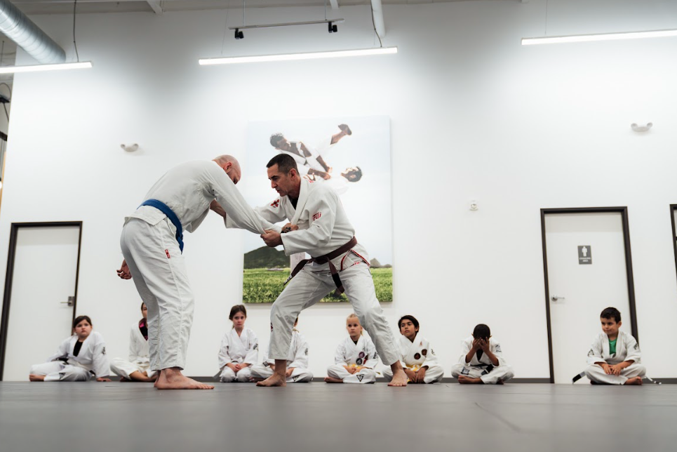 Adults practicing Jiu-Jitsu drills at Academy of Jiu-Jitsu Scottsdale in Scottsdale, AZ.