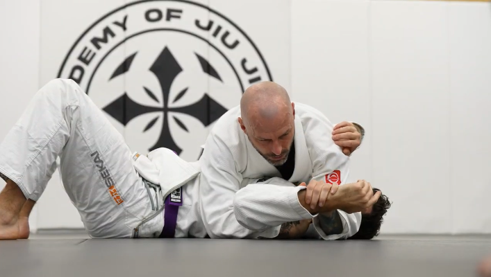 Students practice Jiu-Jitsu drilling at Academy of Jiu-Jitsu Scottsdale in Scottsdale, AZ for strength and balance.