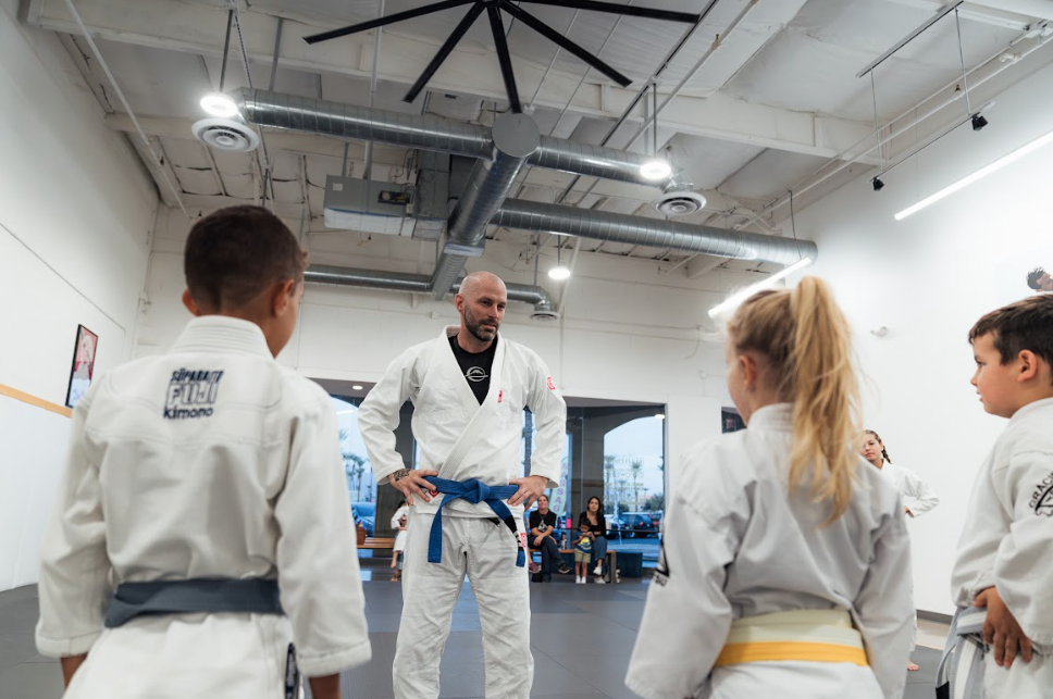 Kids practicing karate drills at Academy of Jiu-Jitsu Scottsdale in Scottsdale, AZ to build focus an