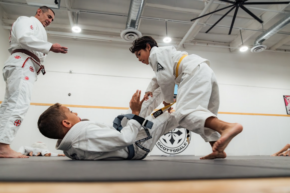 Kids practicing controlled grappling drills at Academy of Jiu-Jitsu Scottsdale in Scottsdale, AZ.