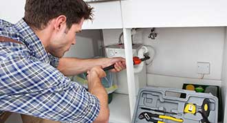 Plumber Fixing Sink in Kitchen - Drain Cleaning in Fort Collins, CO