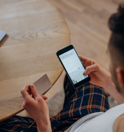 Person using credit card for payment from phone.