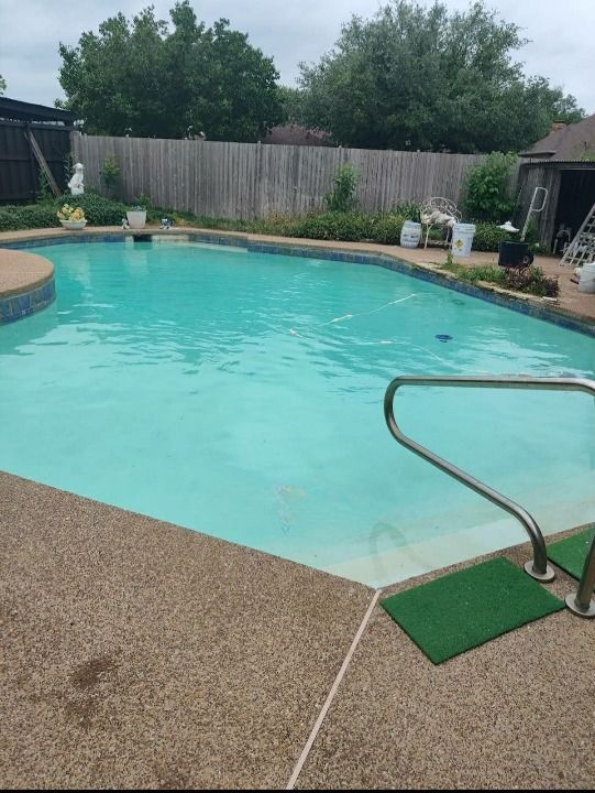 A picture of a swimming pool after being cleaned.