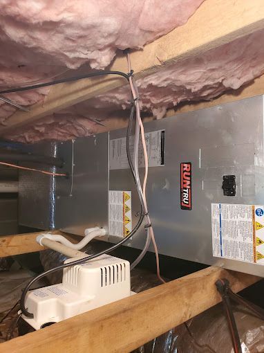 A picture of a heating system in a basement.