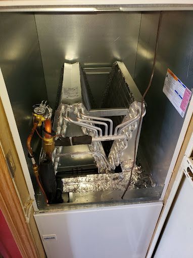 The inside of a refrigerator with the door open.