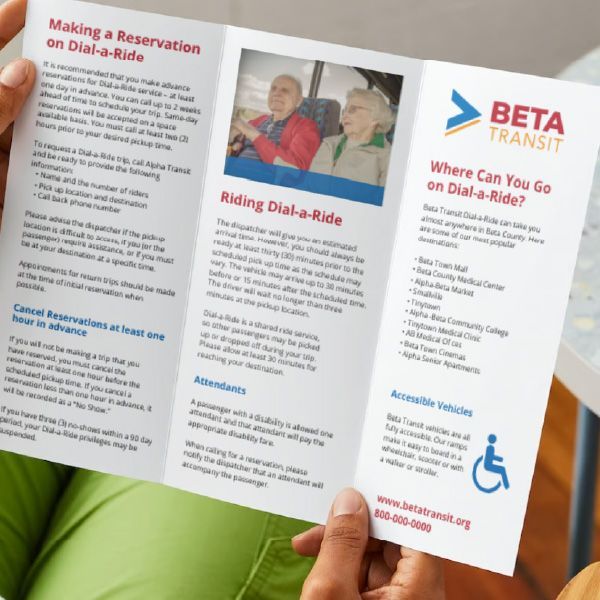 A person is holding a beta transit brochure.