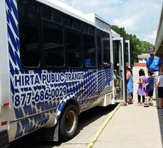 Children boarding a HIRTA bus