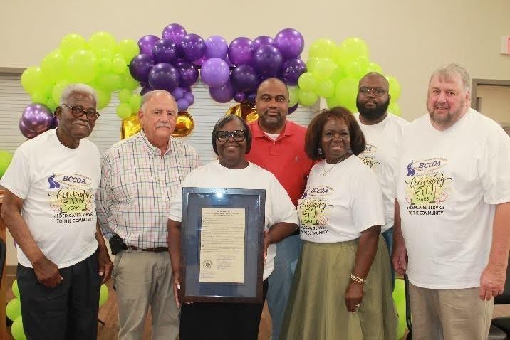 BCCOA staff celebrating a milestone