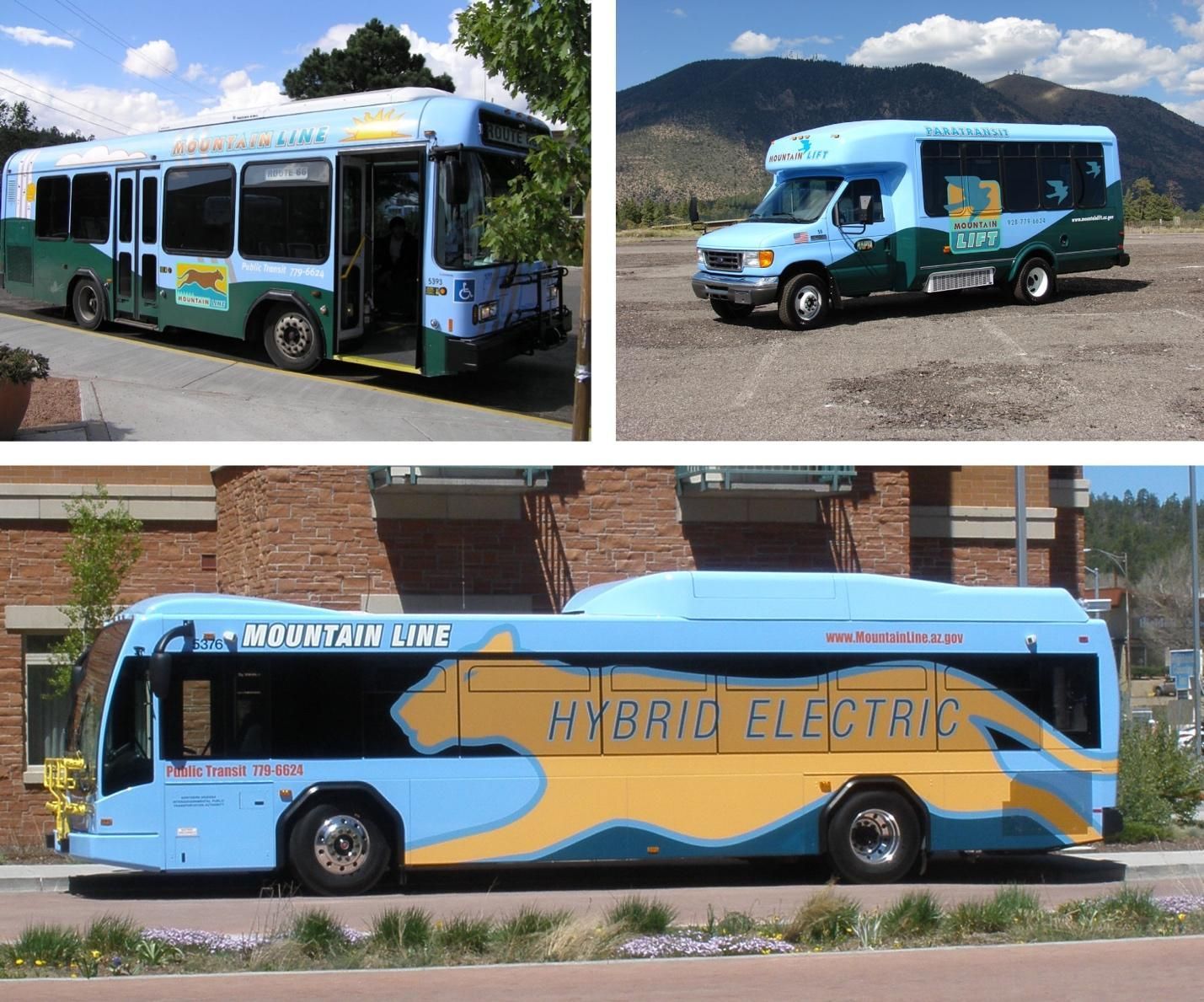 A hybrid electric bus is parked in front of a brick building and in front of a set of mountains.