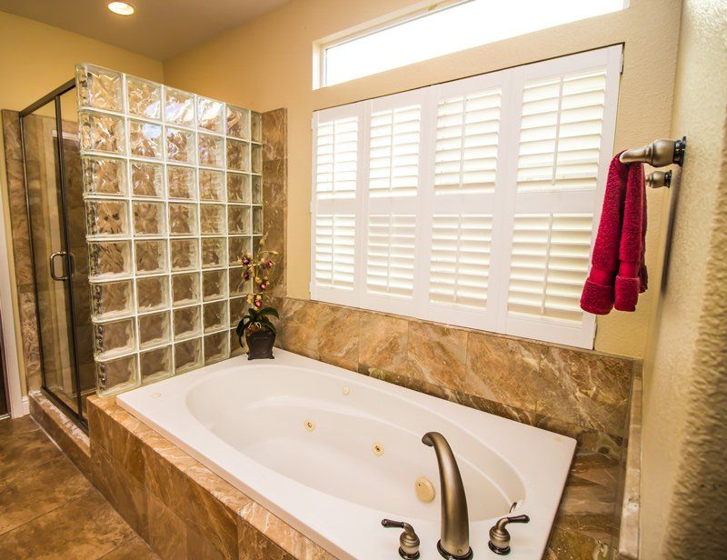 White Shutters on Bathroom — Denham Springs, LA — Blinds By Tones & Textures