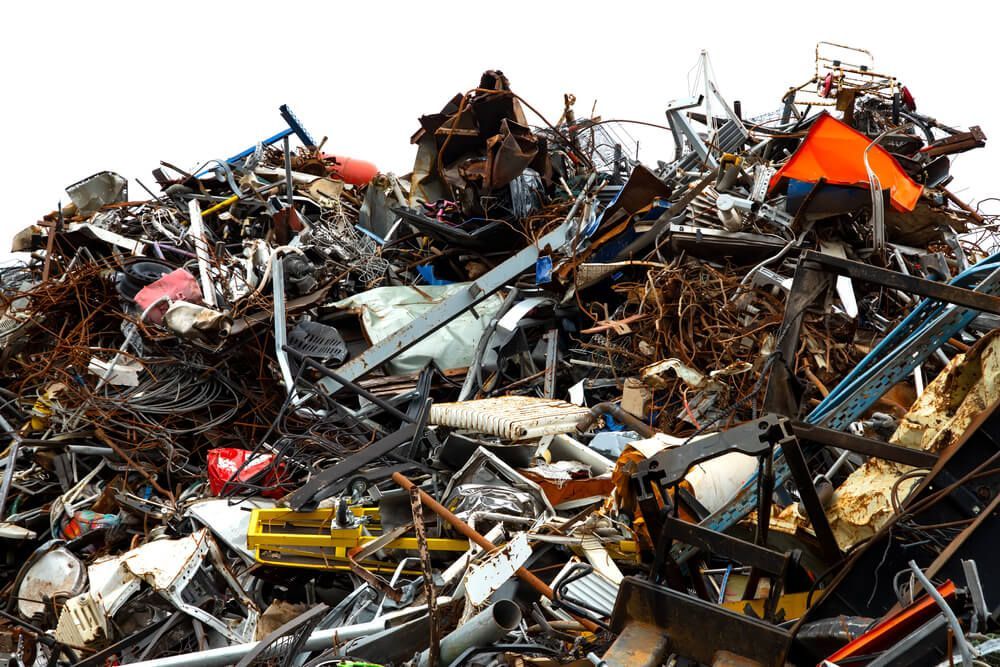 A pile of scrap metal in a junk yard — Economy Waste Group | Skip Bins Central Coast In West Gosford, NSW
