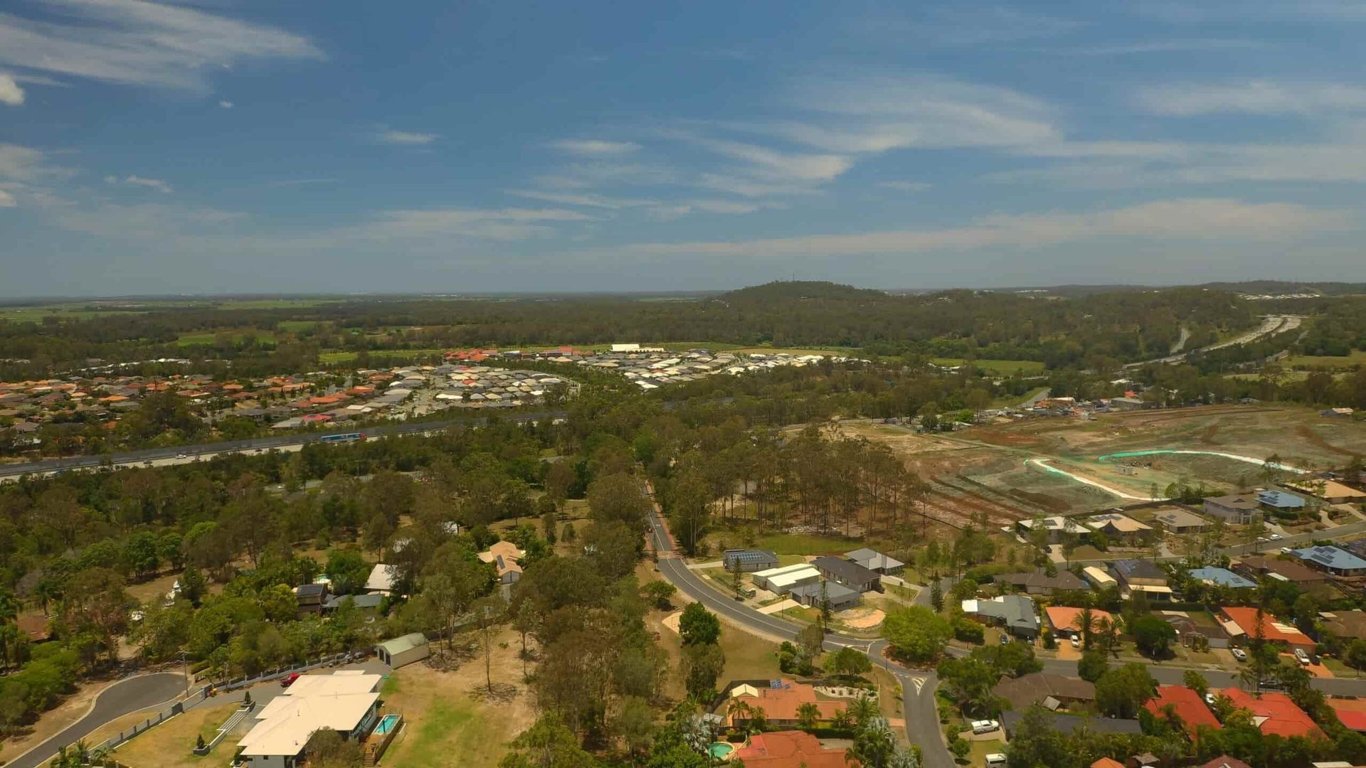 An Aerial View Of People Swimming In The Ocean — Economy Waste Group | Skip Bins Central Coast In Wyee, NSW