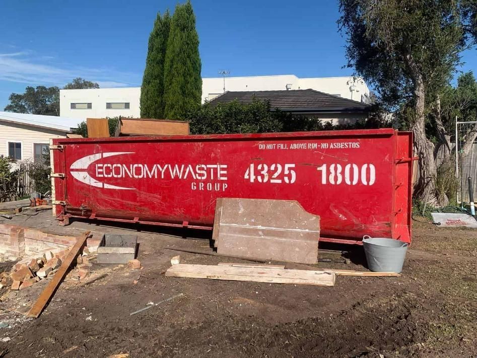 A Red Dumpster With The Number 4325 1800 On It — Economy Waste Group | Skip Bins Central Coast In Davistown, NSW