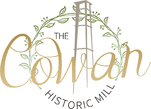 A logo for the colman historic mill with a water tower
