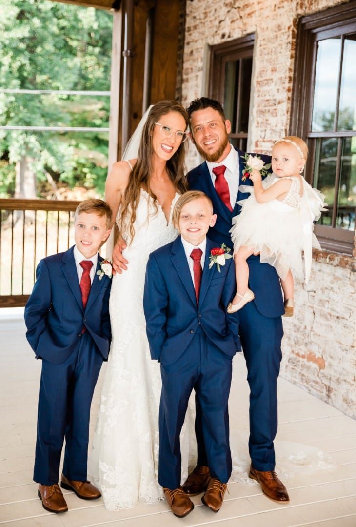 Family photo on upper patio terrace at The Cowan Historic Mill in Acworth, GA 

