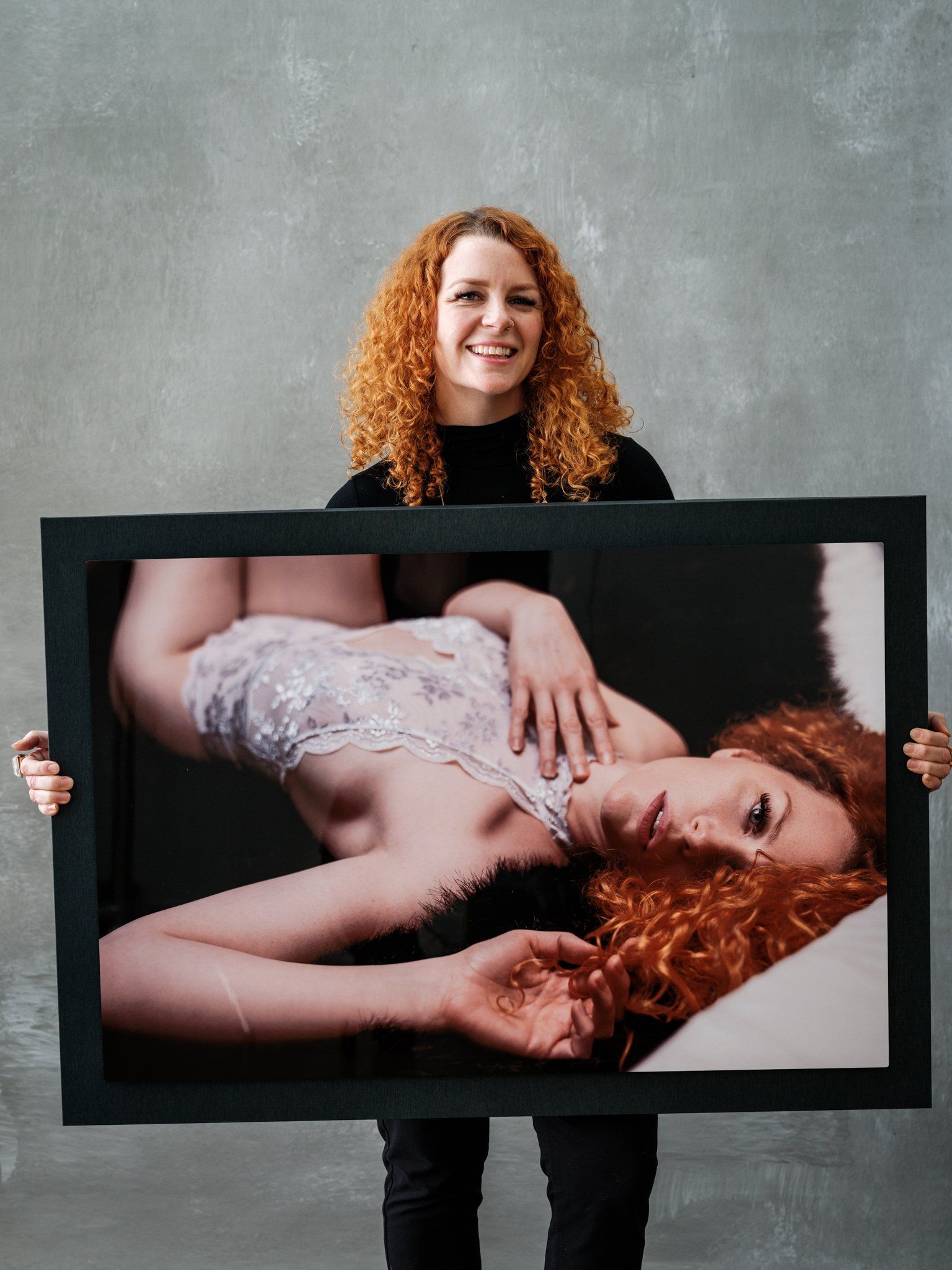woman holding her portrait