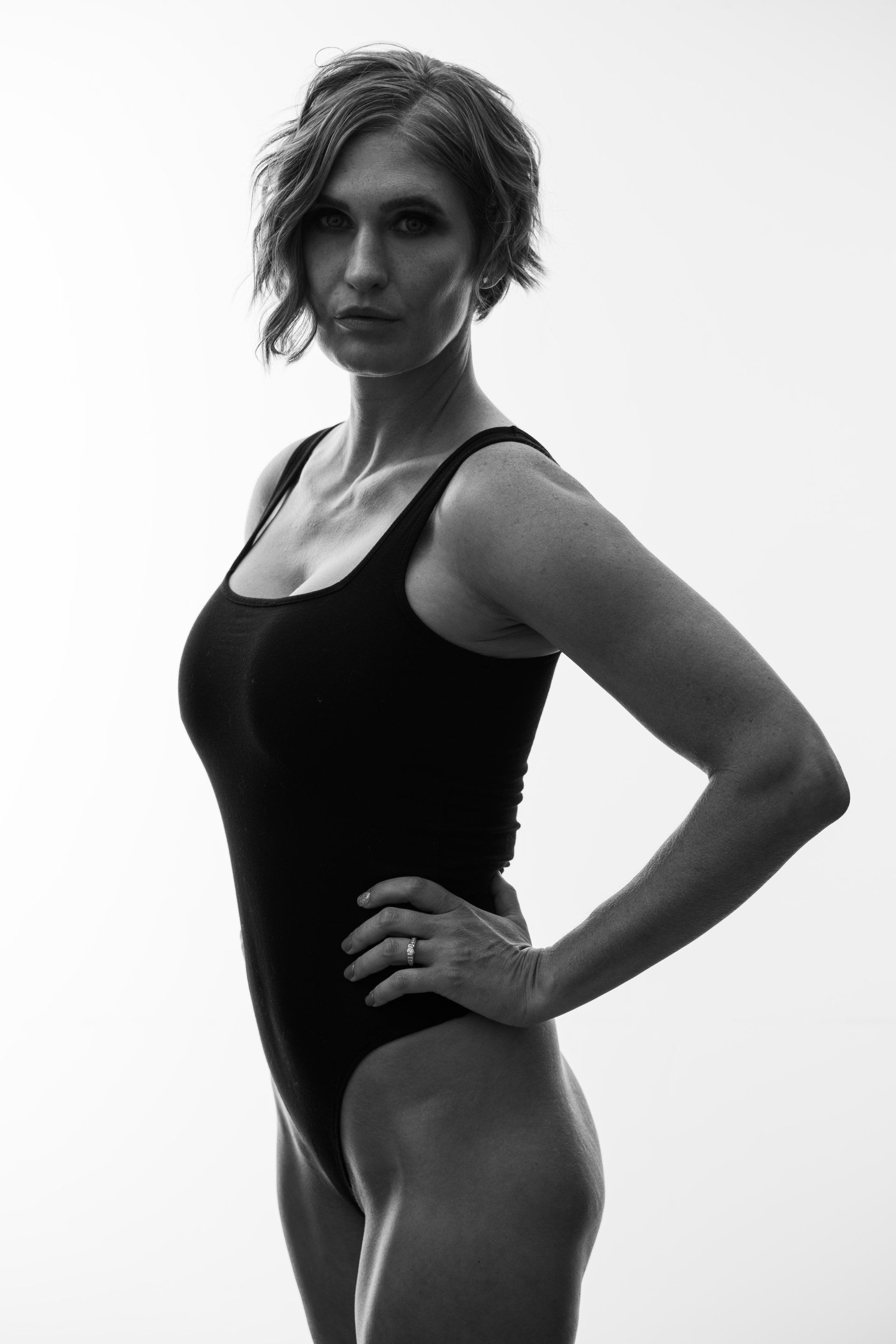woman with short hair  wearing black swimsuit 