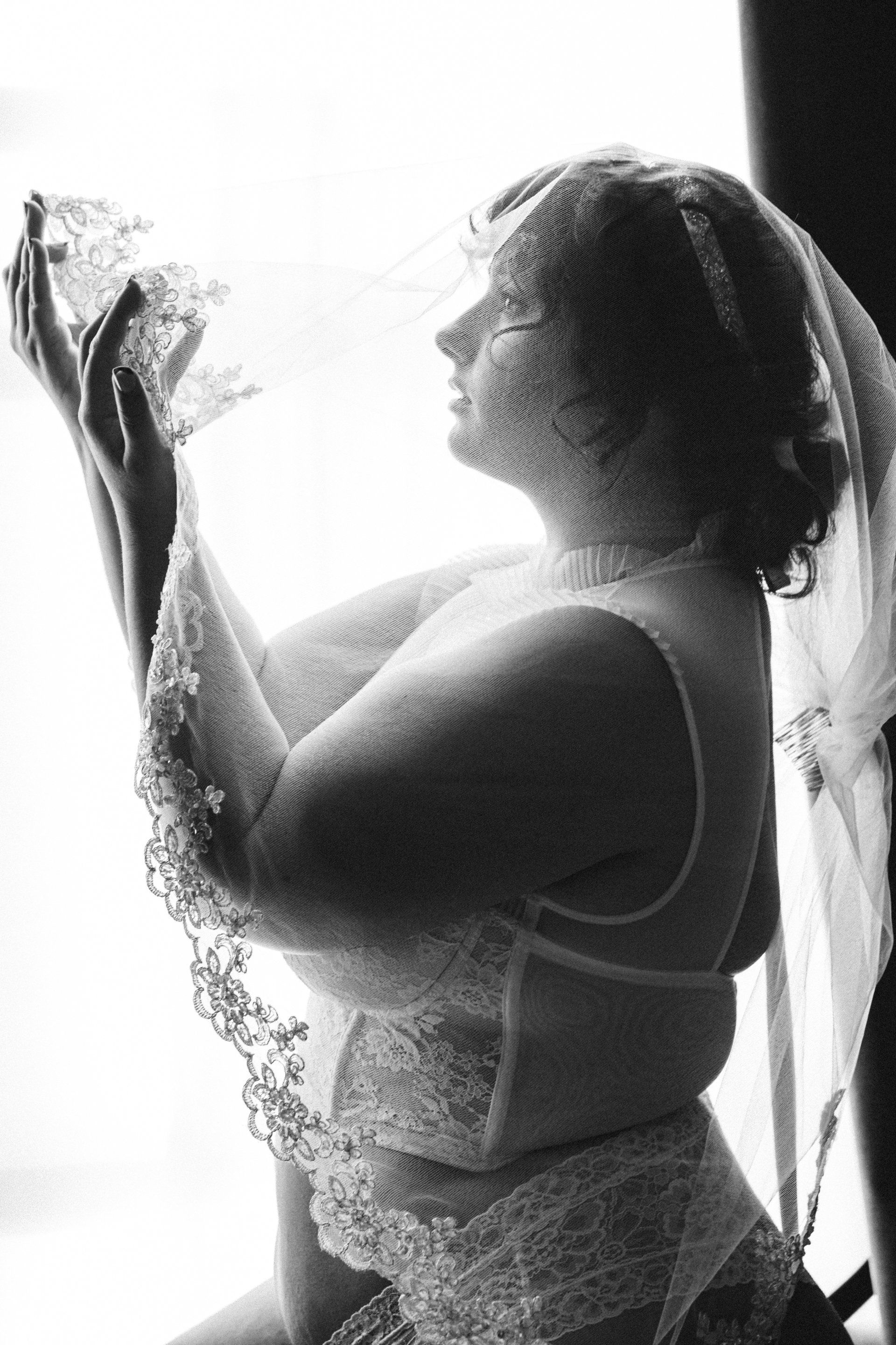 photo of woman wearing bridal gown in black and white color