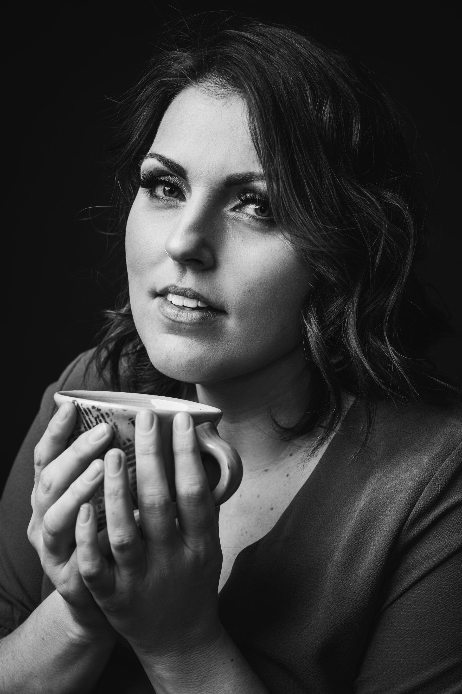 black and white image of woman with tea cup