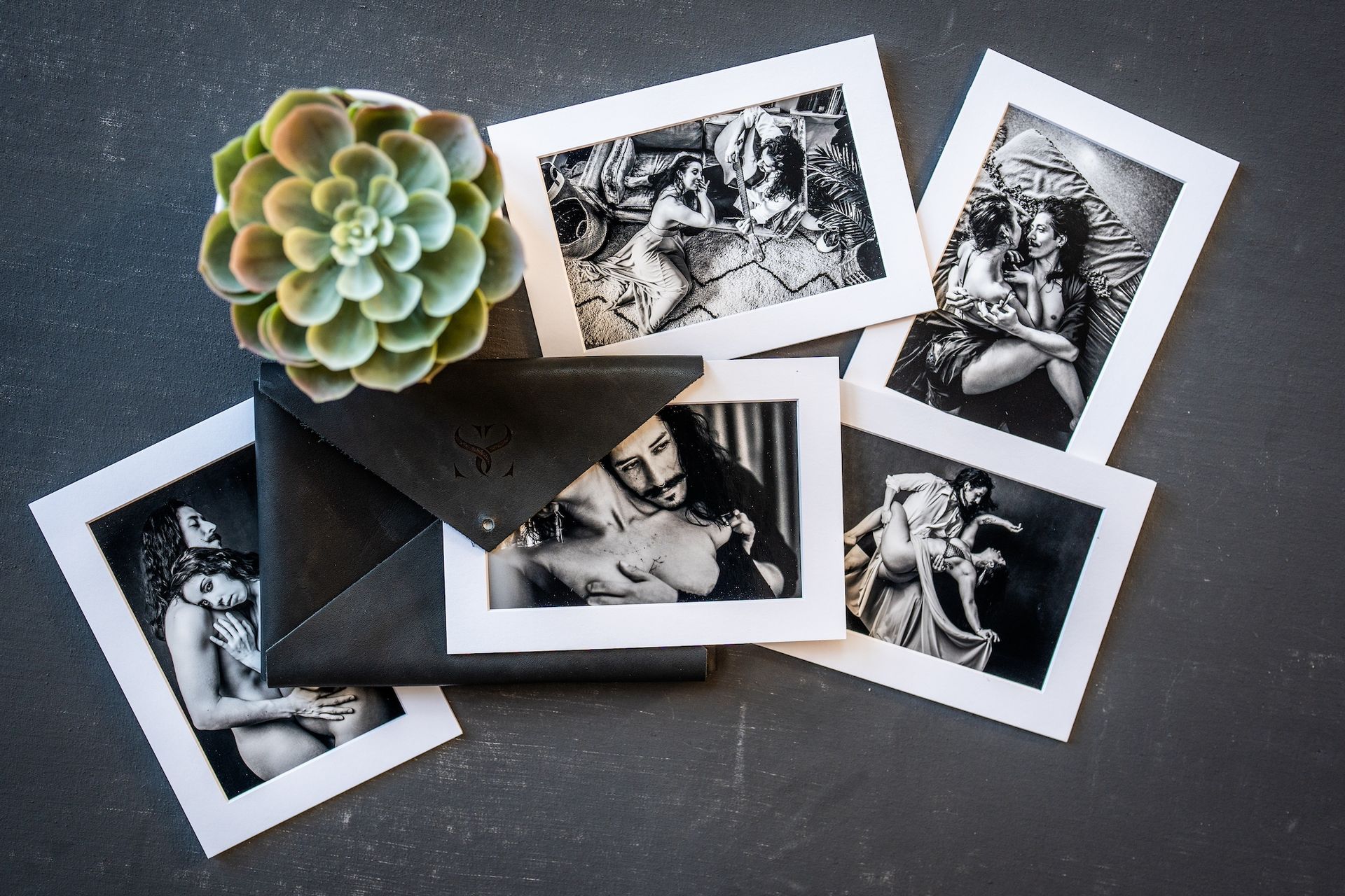  A black and white photo featuring a woman alongside a succulent plant, capturing a serene and artistic moment.
