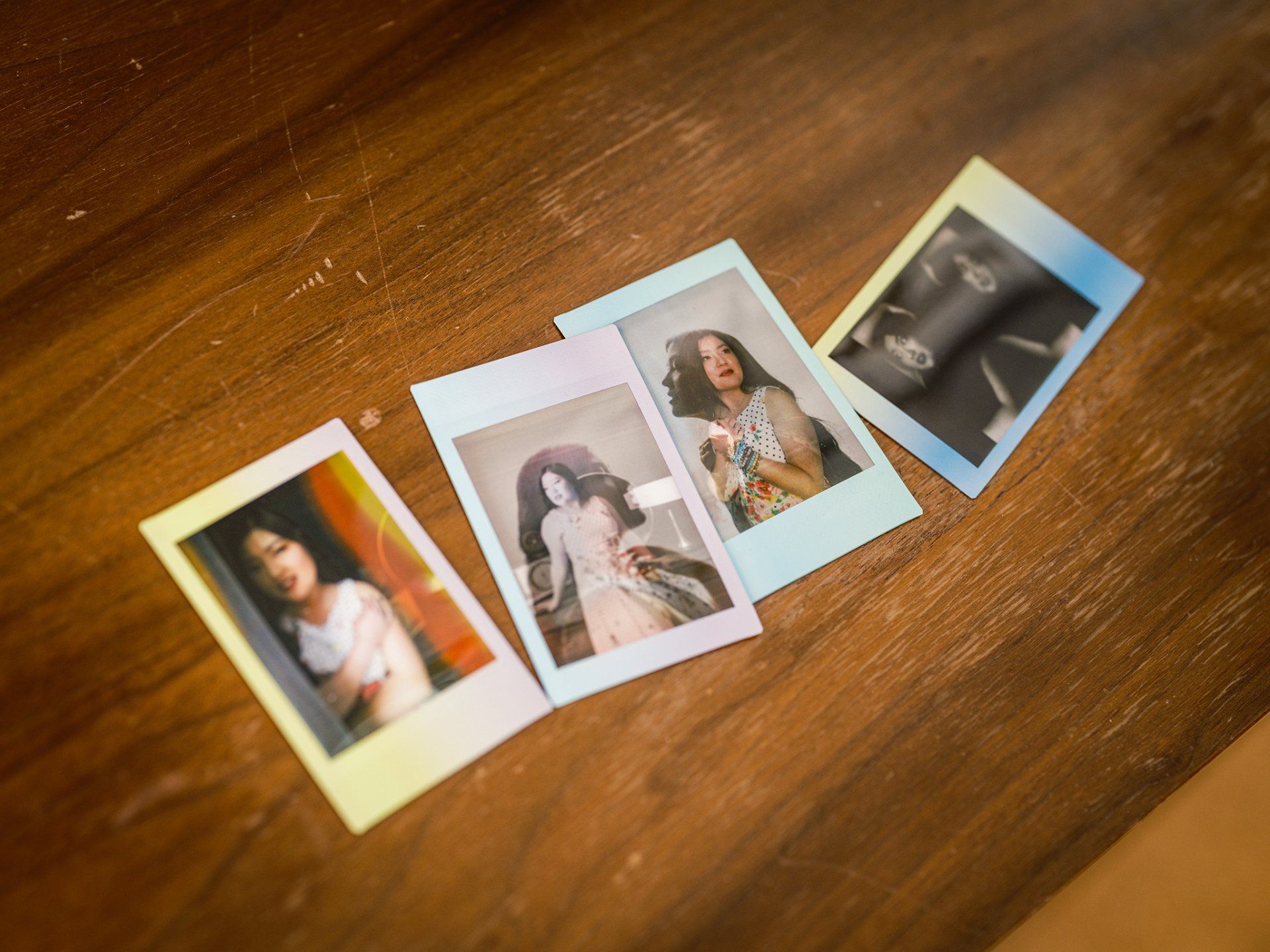 instant film photos laying on a table