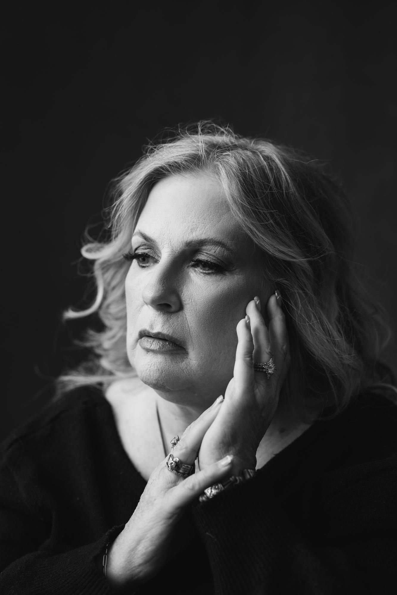 black and white portrait of a woman over 60