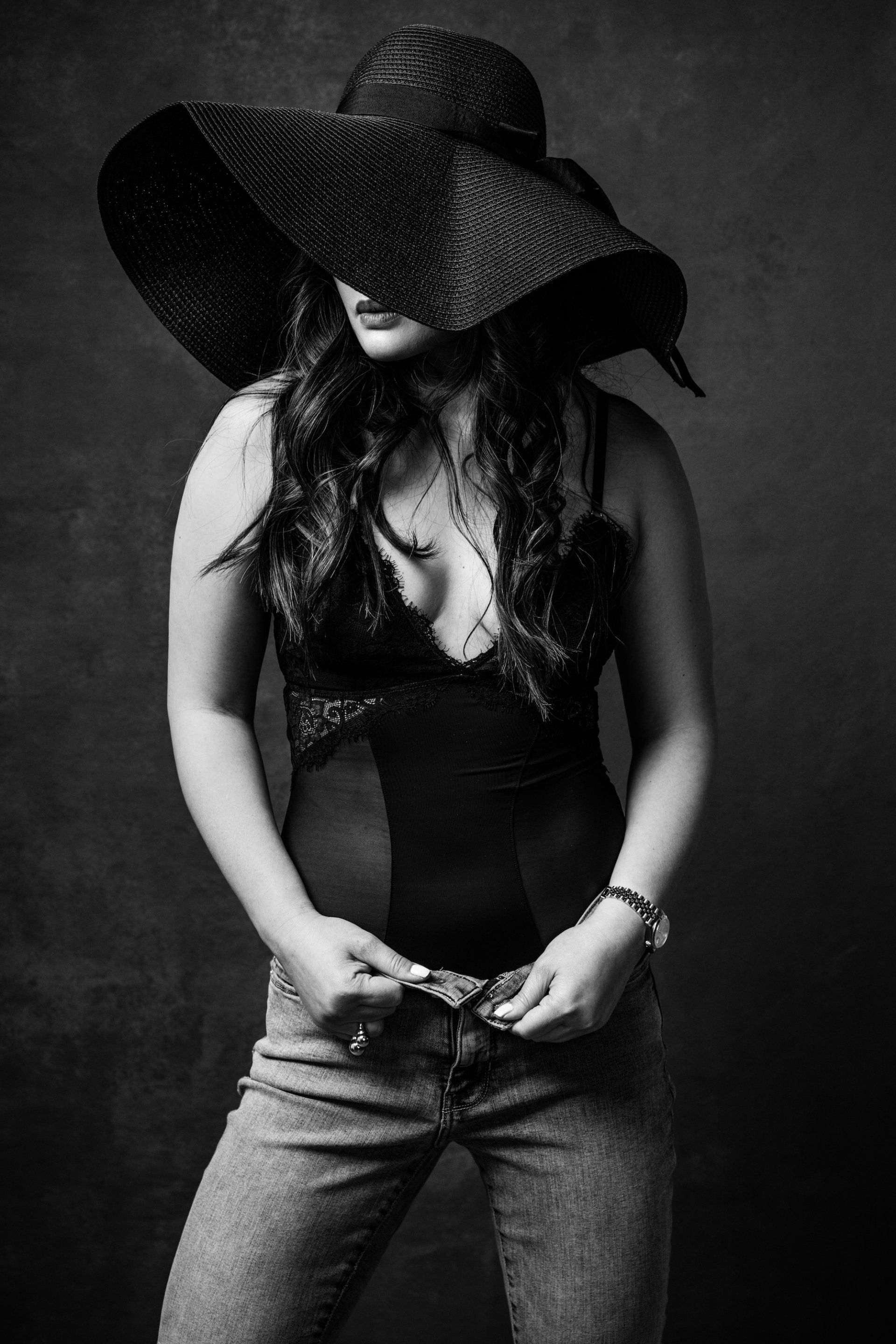 A woman standing confidently, posing for the camera.