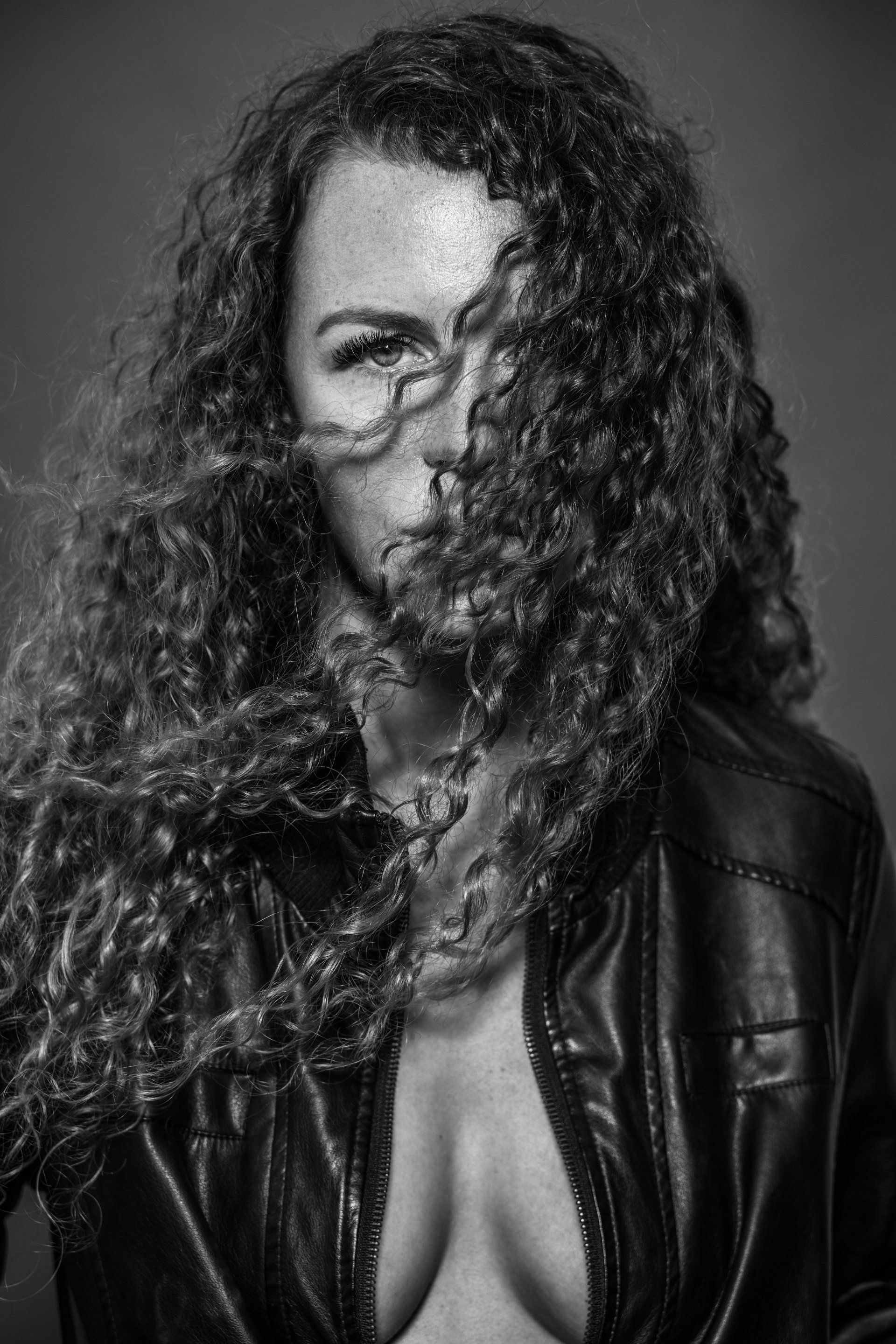 A woman with a curly hair.