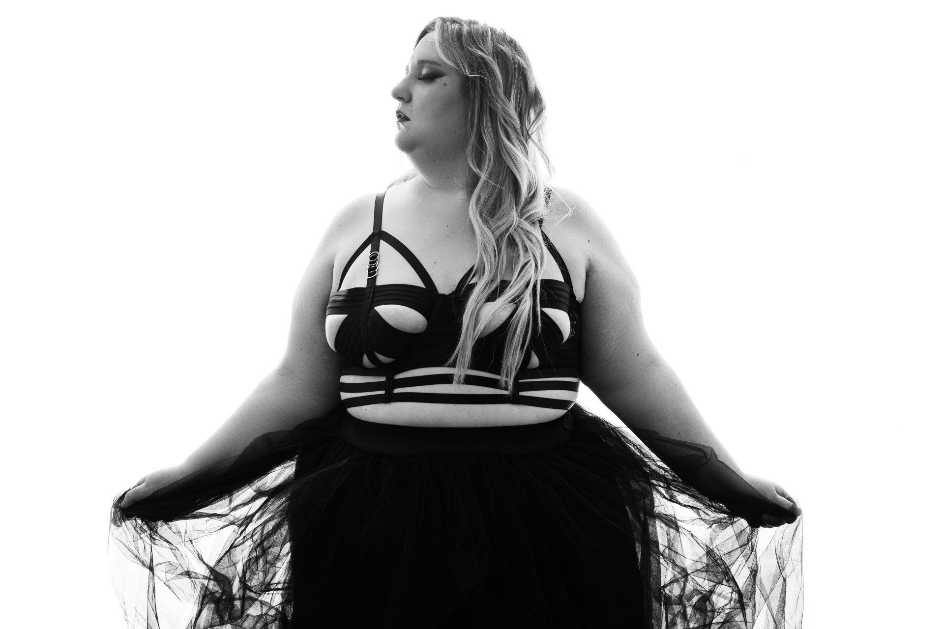 black and white boudoir high contrast blonde woman in black strappy lingerie
