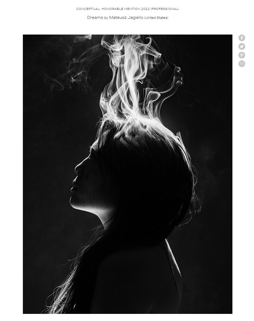 silhouette of a woman with smoke in her hair