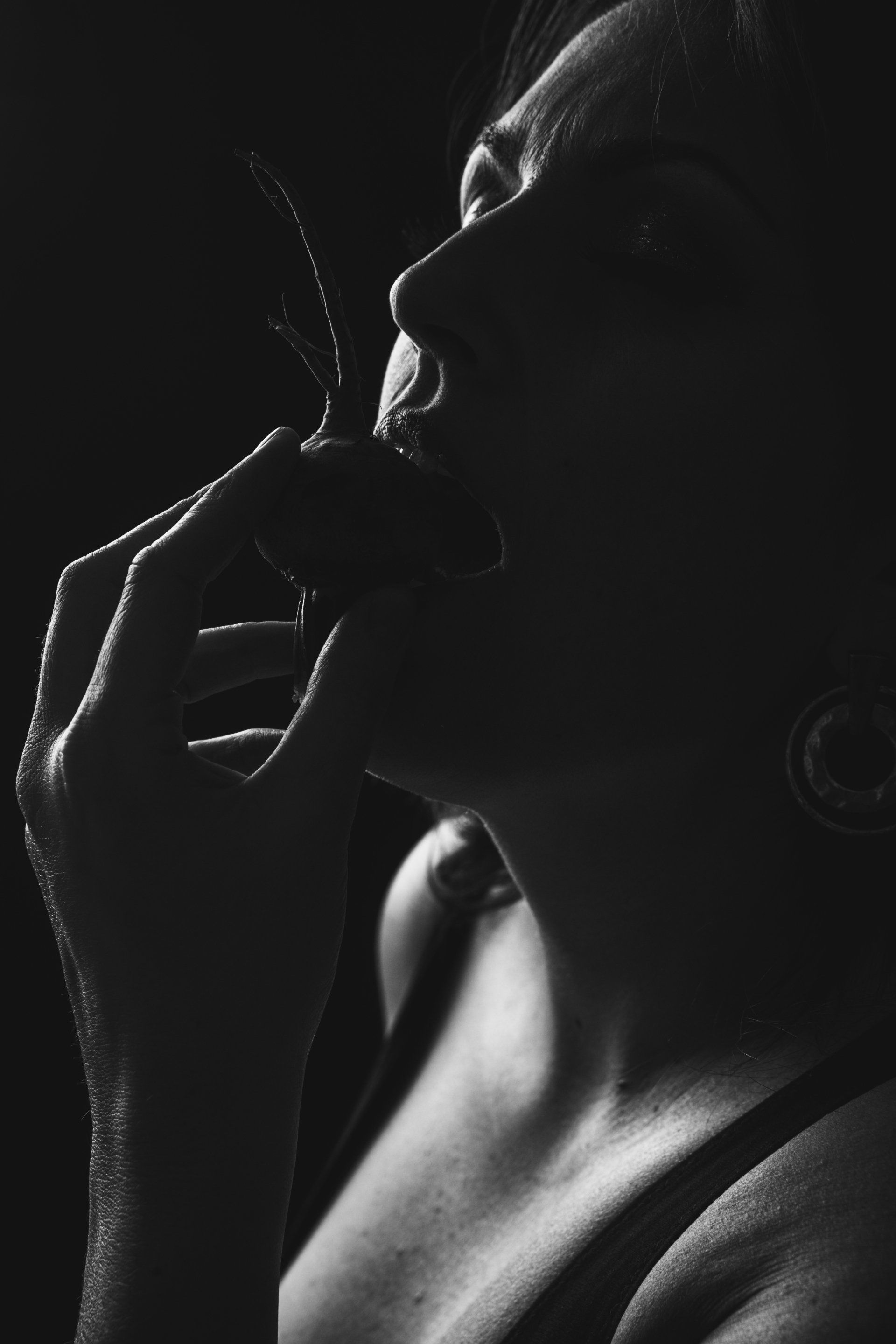 woman eating radish