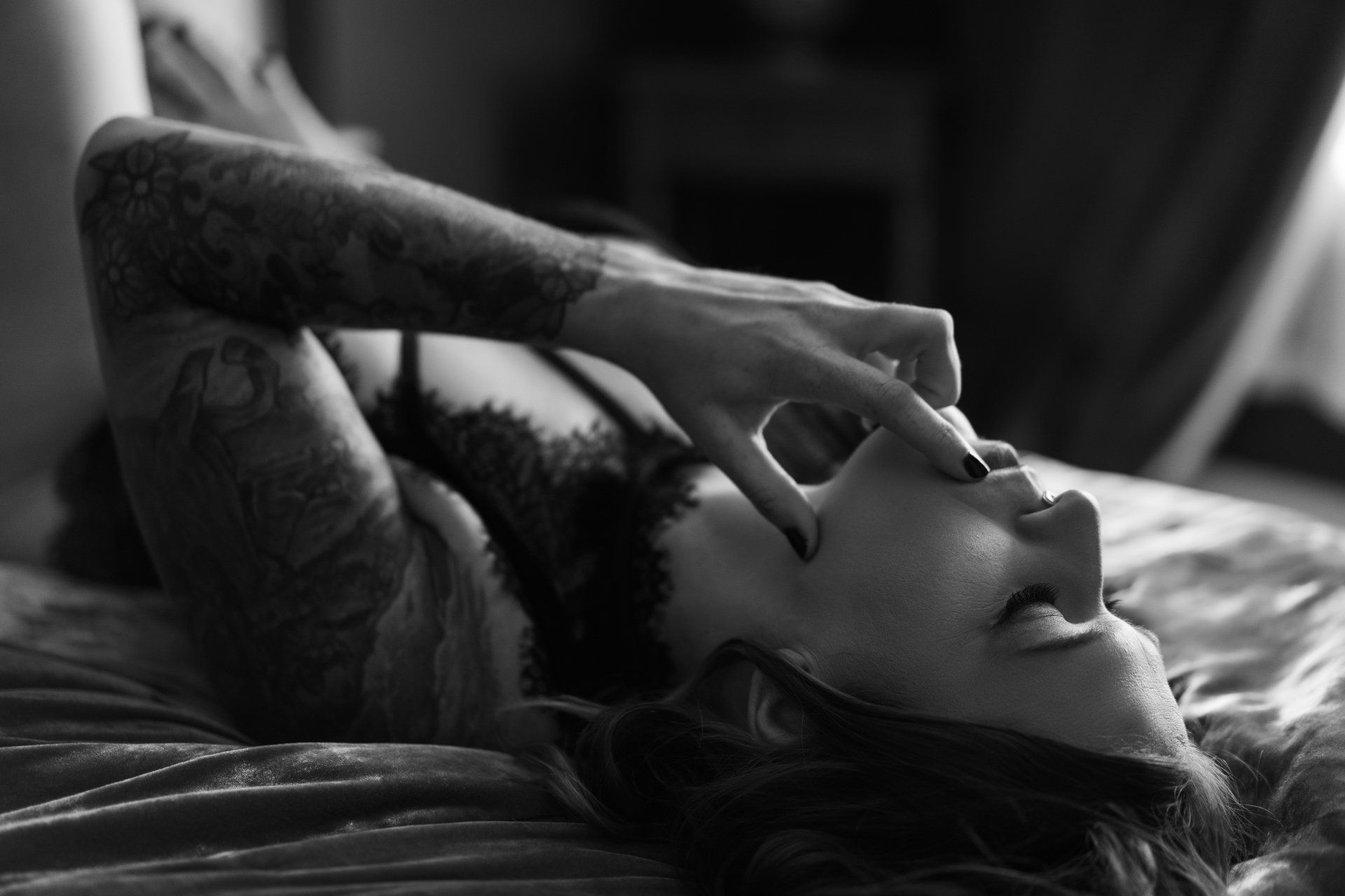 woman laying on back for boudoir pose.