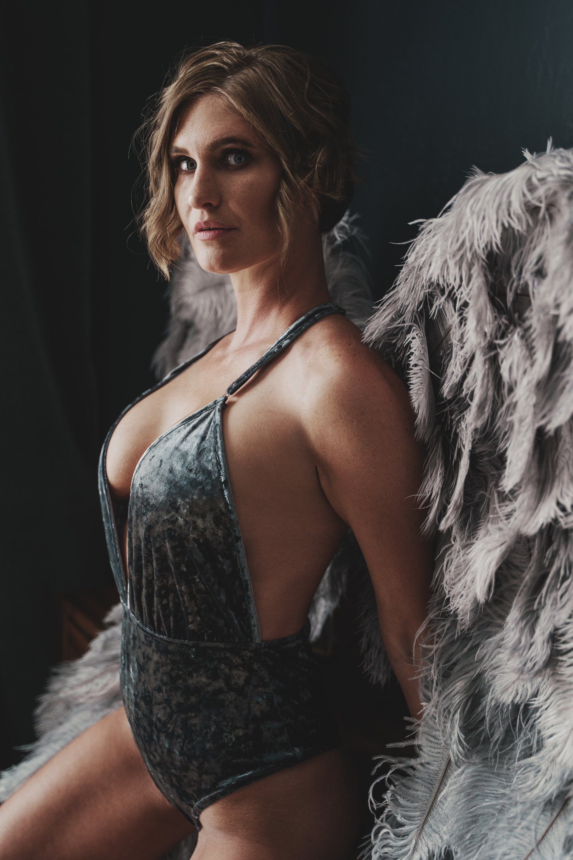 woman wearing wing in velvet dress