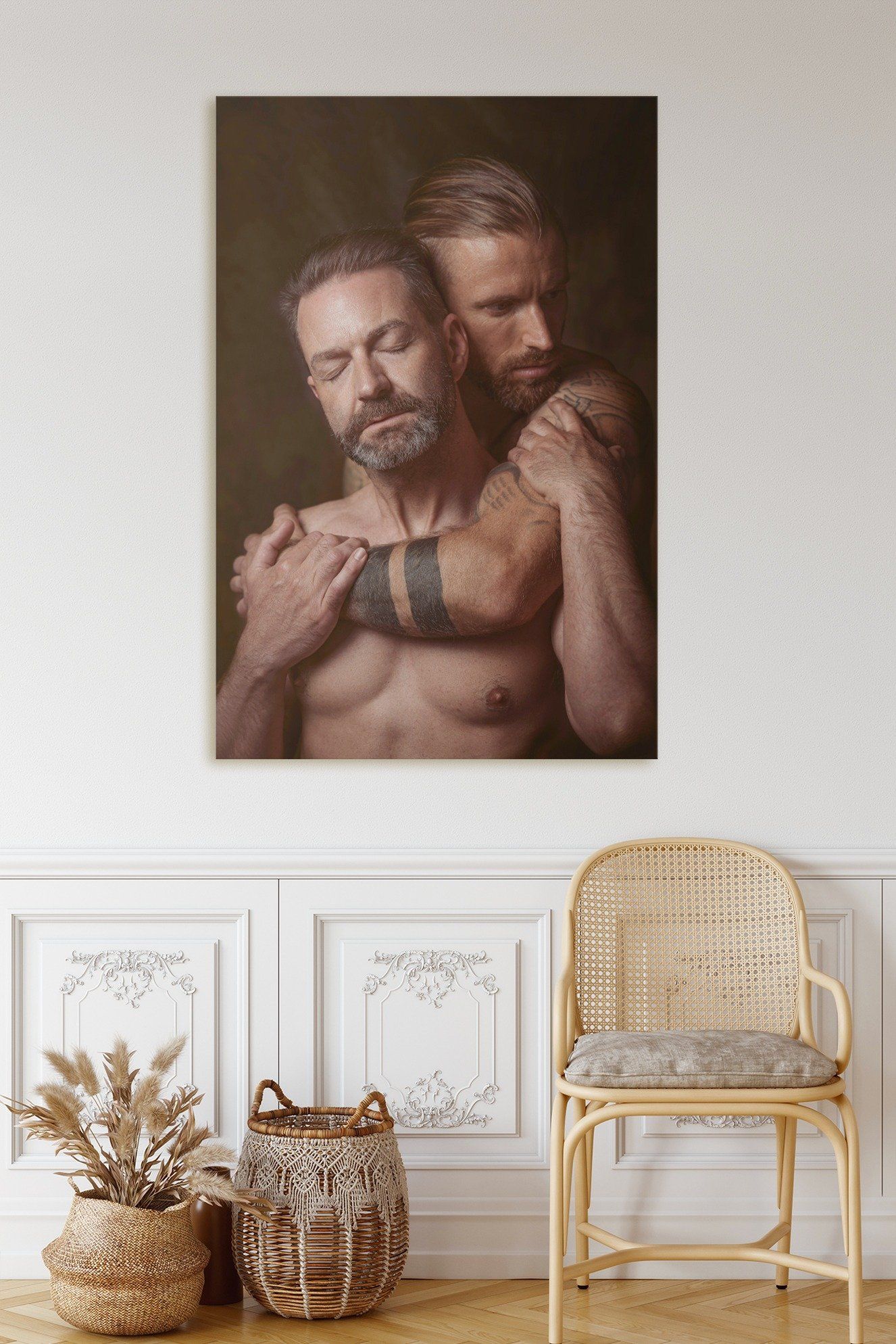 portrait of 2 man hugging each other with a wooden chair