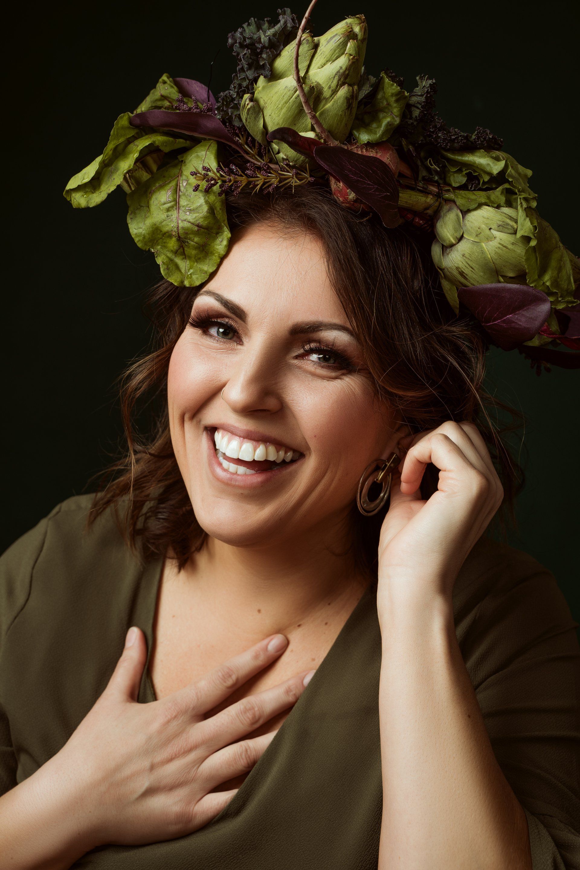 portrait of a woman smiling wearing vegetable crown
